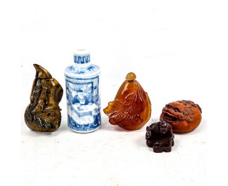 A group of Oriental cabinet items, including a relief carved tigers eye snuff bottle and stopper, height 8cm, an agate snuff 