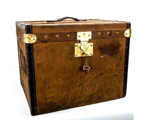MOYNAT PARIS (now owned by LOUIS VUITTON) - a Vintage canvas-covered travelling trunk, with leather edges and brass studded w