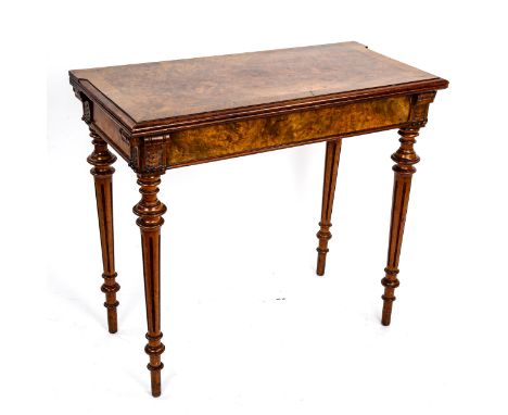 A 19th century rectangular walnut fold over card table, on turned and fluted legs, 85cm x 42cm, height 76cm 