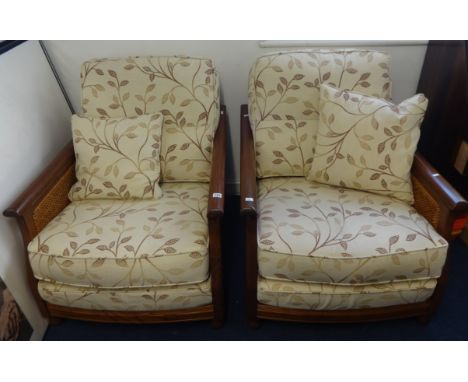 A pair of Ercol armchairs.
