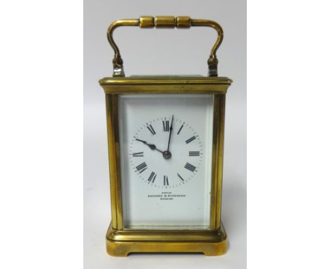 Brass carriage clock with platform escapement, height 16.50cm with handle up.