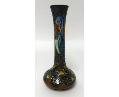 A Moorcroft Peacock Phoenix patterned vase.