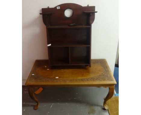 A mahogany shelf unit set with metal plaque, 61cm wide, and carved Indian coffee table