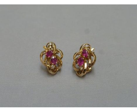 A pair of 14ct gold ruby and diamond earrings.