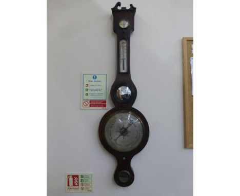 A 19th Century rosewood banjo barometer inscribed Sewell and Sons London.