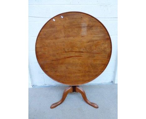 A George III mahogany dish topped tilt top tripod table. 