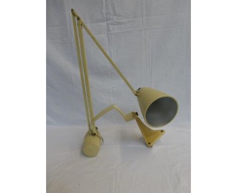 A weighted wall mounted angle poise lamp. 