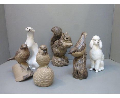 Four Poole pottery models, one of a grey squirrel signed B. Linley Adams, a blue tit, a robin and a wren, also a USSR ceramic