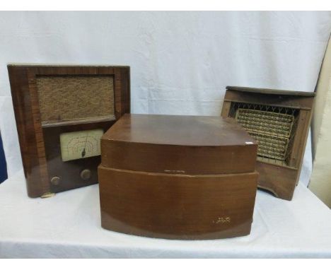 A walnut cased Alba radio, a walnut cased Pye 'Hi-Fi' record player and a faux wooden cased heater. 