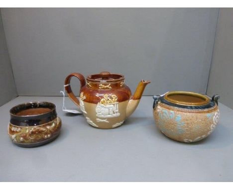 A Royal Doulton Harvester teapot, a Doulton Lambeth Slaters sugar bowl and a Royal Doulton sugar bowl decorated with fish, mo