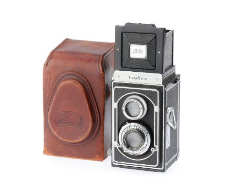 black, body G, shutter works, viewfinder works, with a Tessar f/3.5 75mm lens, optics P, have been over-cleaned.