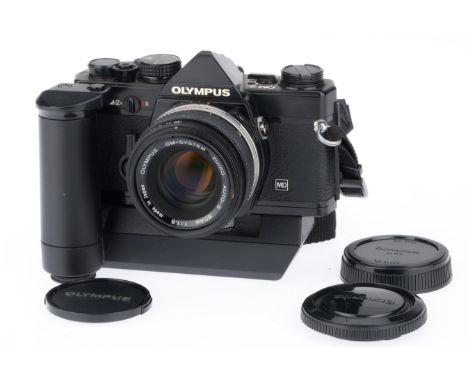 black, body in G-VG condition, shutter working, power winder working, there is a small mark within the viewfinder to the lowe