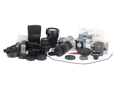 silver, body G, powers up, takes a picture, with charger, two batteries, strap, guide book, and lenses, a Canon EF 75-300mm U