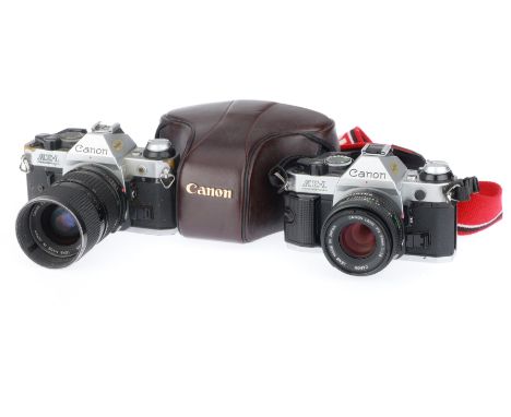 one with a Canon 50mm f/1.8 lens, camera body G, powers up when battery is inserted, appears meter doesn't function, although