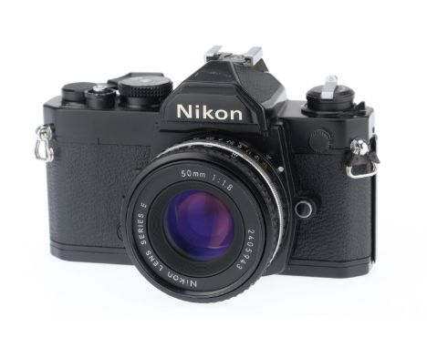 black, serial number 3346552, shutter working, viewfinder LEDs working, meter responds to light, with Nikon Series E f/1.8 50