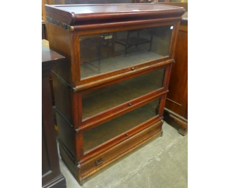 An early 20th Century Globe Wernicke oak three tier sectional stacking bookcase 