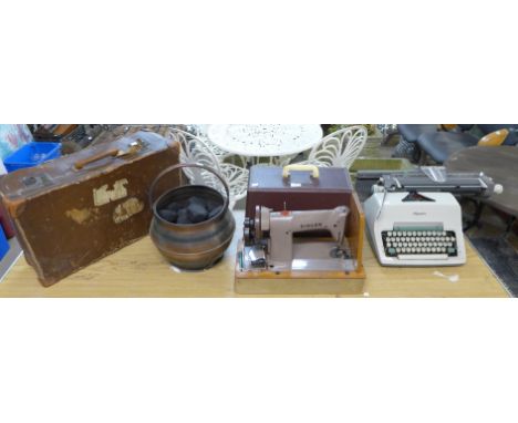 A vintage Singer sewing machine, Olympia typewriter, leather case and a copper coal scuttle 