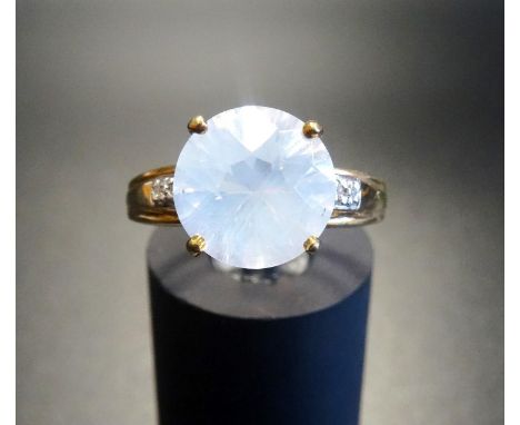 UNUSUAL OPAL DRESS RINGthe central round cut opal flanked by small diamonds to the shoulders, on nine carat gold shank, ring 
