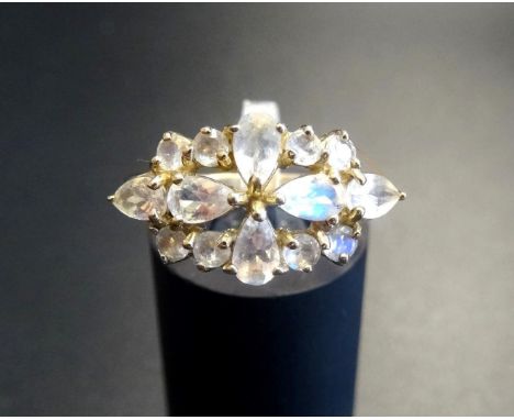 MOONSTONE CLUSTER RINGthe pear and round cut moonstones in pierced setting, on nine carat gold shank, ring size N 