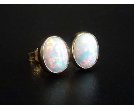 PAIR OF OPAL STUD EARRINGSin nine carat gold 