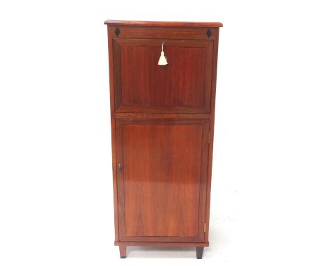 MAHOGANY COCKTAIL CABINETthe upper drop-leaf front with mirrored interior, above a cupboard section with adjustable shelf int