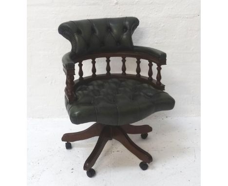 LEATHER AND MAHOGANY FRAMED CAPTAIN'S CHAIRwith button backrest and seat, raised on five branch base support with castors 