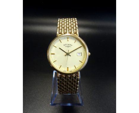 GENTLEMAN'S ROTARY NINE CARAT GOLD WRISTWATCHon nine carat gold strap, the cream dial with baton five minute markers and date