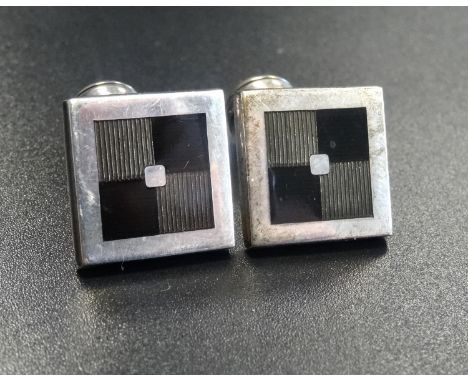 PAIR OF DESIGNER SILVER AND ENAMEL CUFFLINKSwith square tops and shaped fasteners, Birmingham 2000 