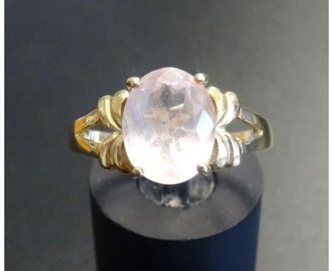 ROSE QUARTZ DRESS RINGthe oval cut quartz on nine carat gold shank with decorative pierced shoulders, ring size N 