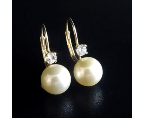 PAIR OF DIAMOND AND SIMULATED PEARL EARRINGSin fourteen carat gold mounts 