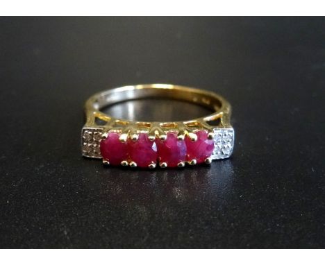 RUBY AND DIAMOND RINGthe four oval cut rubies flanked by four small diamonds to each shoulder, on nine carat gold shank, ring