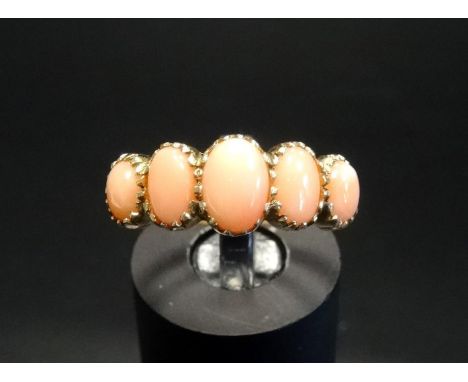 GRADUATED CORAL FIVE STONE RINGon nine carat gold shank, ring size N 