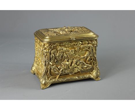 A Continental Fire-Gilded Tea Caddy. With hinged cover which opens to reveal to lined compartments, the box embossed with fig