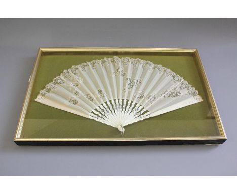 A 19th Century Fan; the fan having ivory sticks with delicate lace and gauze body, extended the fan measures approx 63 x 34 c