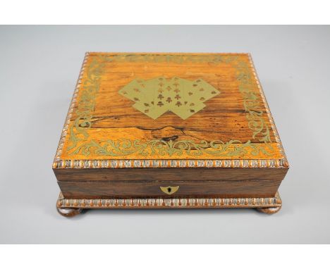A Card Games Box, with decorative brass inlay, approx 23 x 20 x 8 cms, complete with two packs of playing cards.