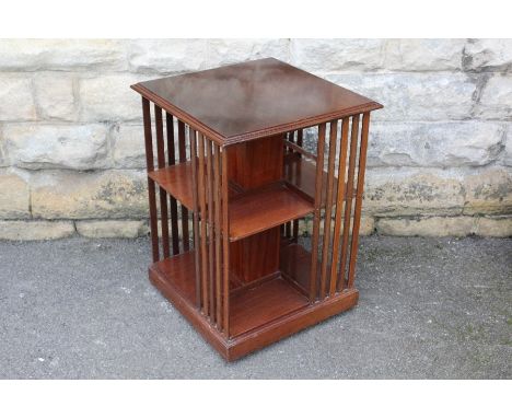 A Mahogany Revolving Bookcase; the bookcase on casters having one shelf on each side, approx 51 x 51 x 69 cms.