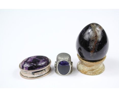 Miscellaneous Blue John, including a silver and Blue John pill box, thimble and a paperweight. (3)