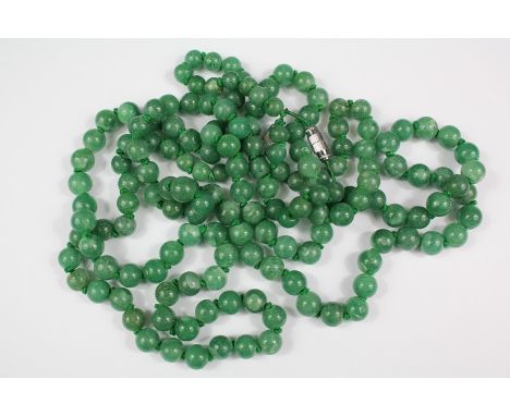 Two Green Moss Agate Bead Necklaces, the beads approx 8mm, necklace length approx 72 cms, together with a red agate necklace,