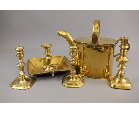 Antique Brass Items - this lot comprises a watering can, a good quality chamber light and three brass candlesticks.