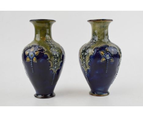 Royal Doulton Lambeth pair of vases, Art Nouveau, with blue and green glaze, floral decoration, 14.5cm tall (2 - 1 restored).
