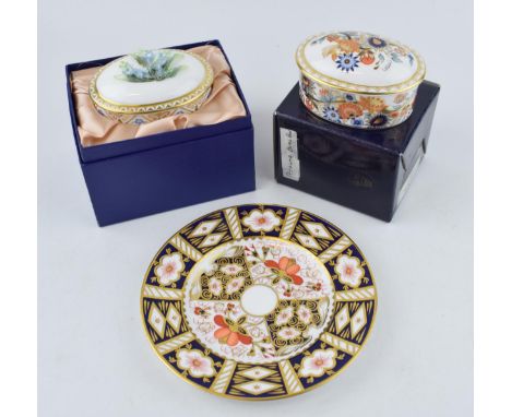 Two Royal Crown Derby oval trinket dishes and covers, Forget-Me-Not pattern, signed by and painted by M. E. Reynolds, the cov