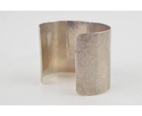 Sterling silver hammered wide bangle, 65.2 grams, 52mm wide, London 2011, M C Hersey &amp; Son Ltd (Stewart Hersey).  