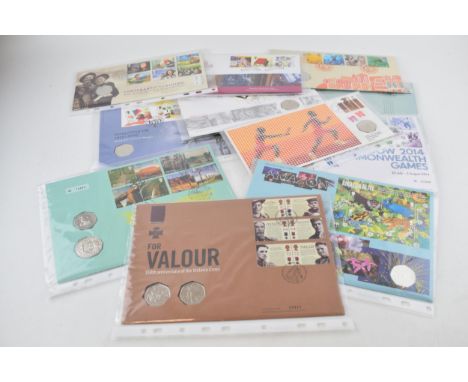 A collection of 11 First Day Covers, with 50p coins, to include World Heritage Sites, For Valour, Protecting the Amazon and o