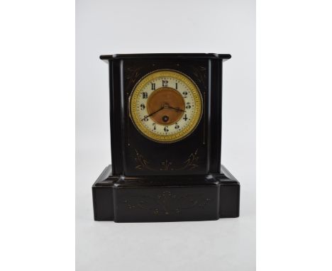 A slate mantle pendulum clock. Ceramic dial on brass with gilt edging. Stylised floral gilt decoration to case. Height 18cm. 