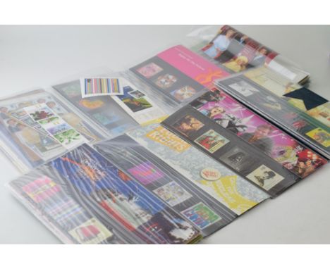31 x UK presentation packs of stamps, together with additional sets and FDC (First Day Covers)  