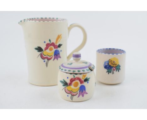 A group of Carter, Stabler and Adams and Poole Pottery pieces, c. 1930s. Including a milk jug by Phyllis Way, a preserve pot 