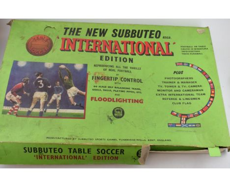 A vintage Subbuteo set with pitch, vintage additional player sets and later flood-lights. a/f.  In play worn condition with d
