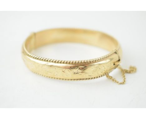9ct hallmarked hollow gold bangle, 20.7g  Some denting.