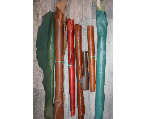 A quantity of vintage and antique leather calf skins. To include calf skins, brown / tan approx 79cm x 42cm, dark brown 56cm 