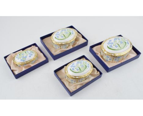 A set of four Royal Crown Derby Forget-Me-Not pattern graduated oval trinket dishes and covers, the largest 8cm wide, each wi
